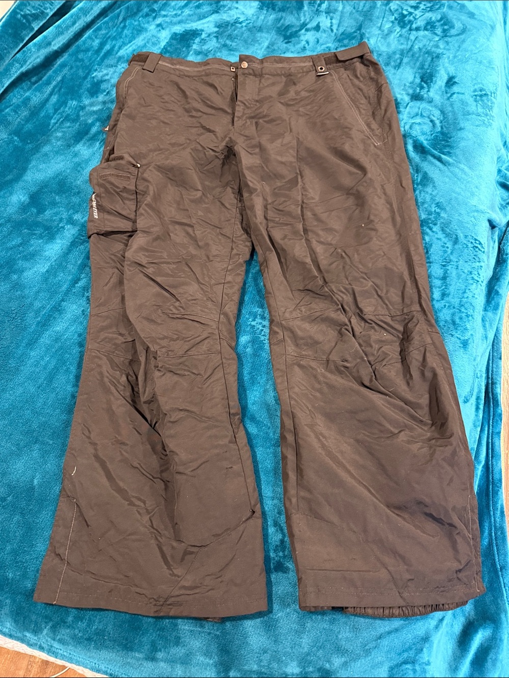 Men's Black Obermeyer Snow Pants with light insulation.